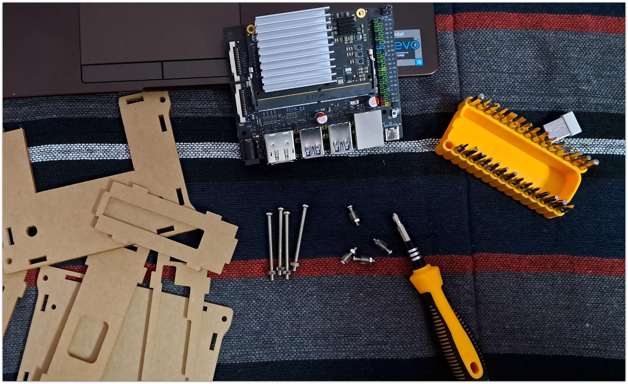 aim7 board assembled with diy enclosure and screws lying around