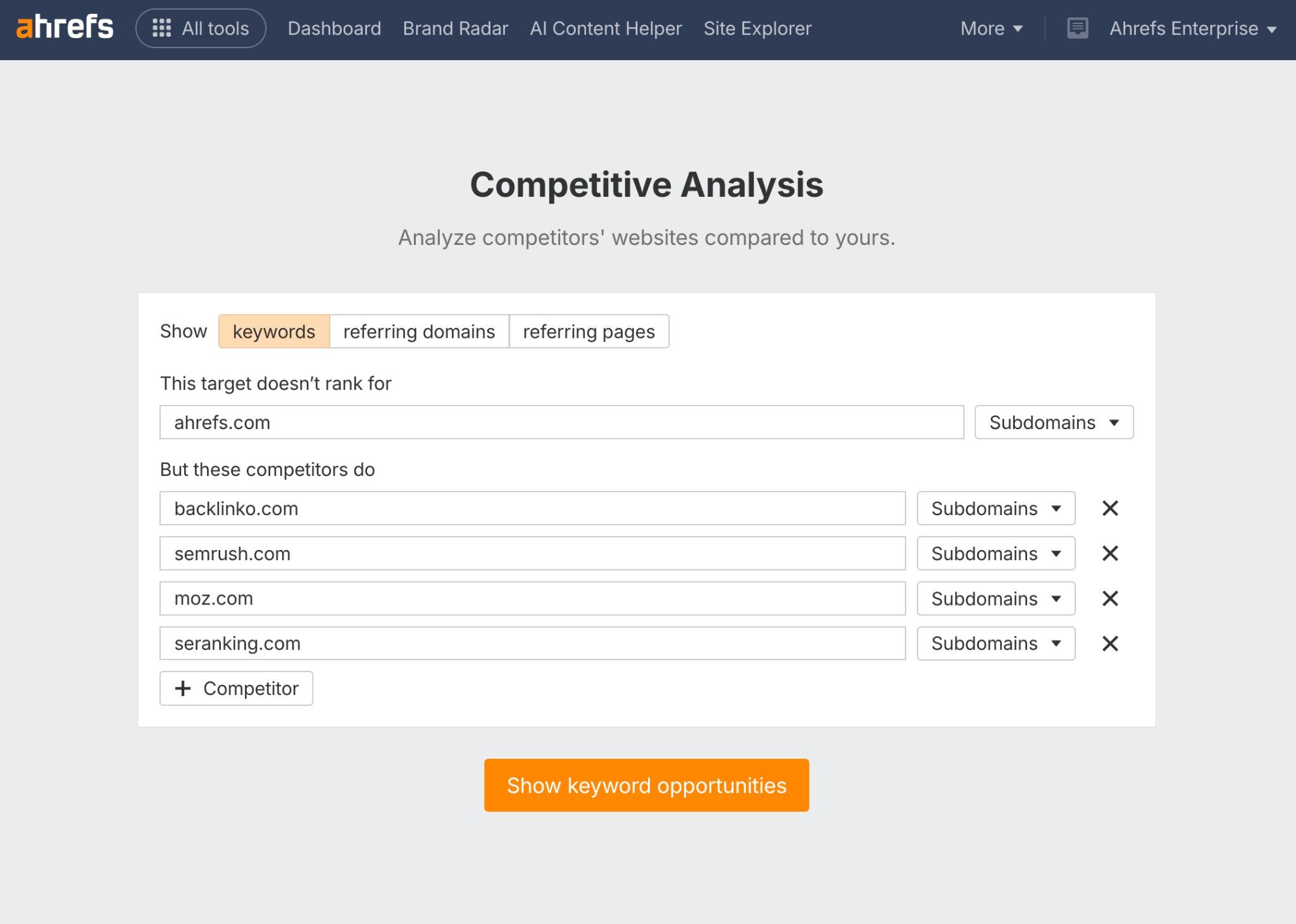 Screenshot of Ahrefs Competitive Analysis setup page. Shows options to analyze competitors' websites compared to yours, with tabs for "keywords," "referring domains," and "referring pages." Contains input fields for target website (ahrefs.com) and competitor websites (backlinko.com, semrush.com, moz.com, seranking.com) with an orange "Show keyword opportunities" button at the bottom.
